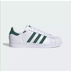 White and green adidas sneakers